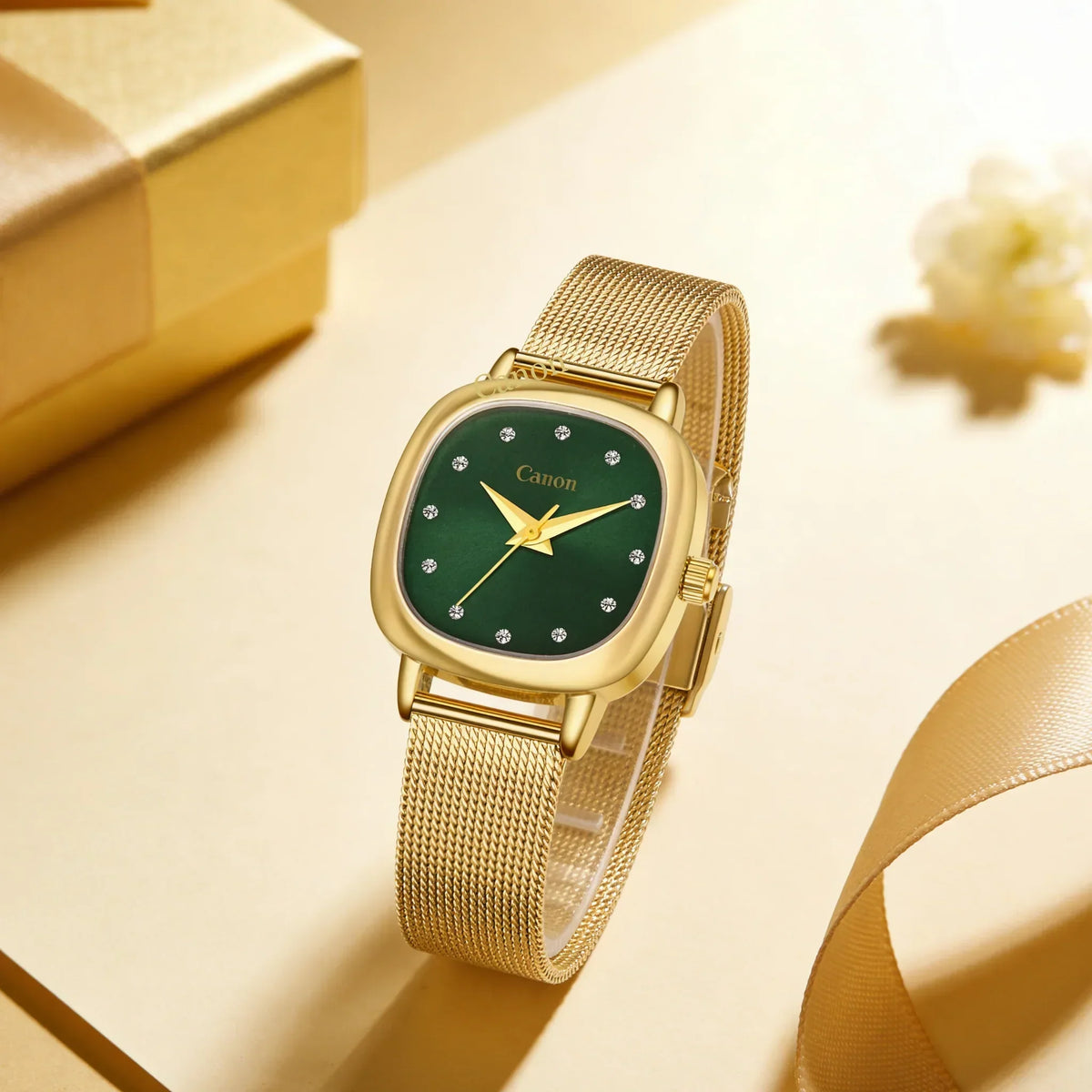 Elegant gold watch with green dial and crystal markers, perfect for women's classic style