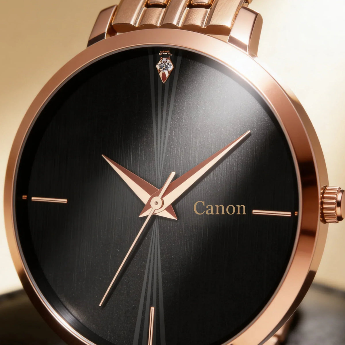Rose gold analog watch with black dial, diamond accent, and Canon logo for men or women
