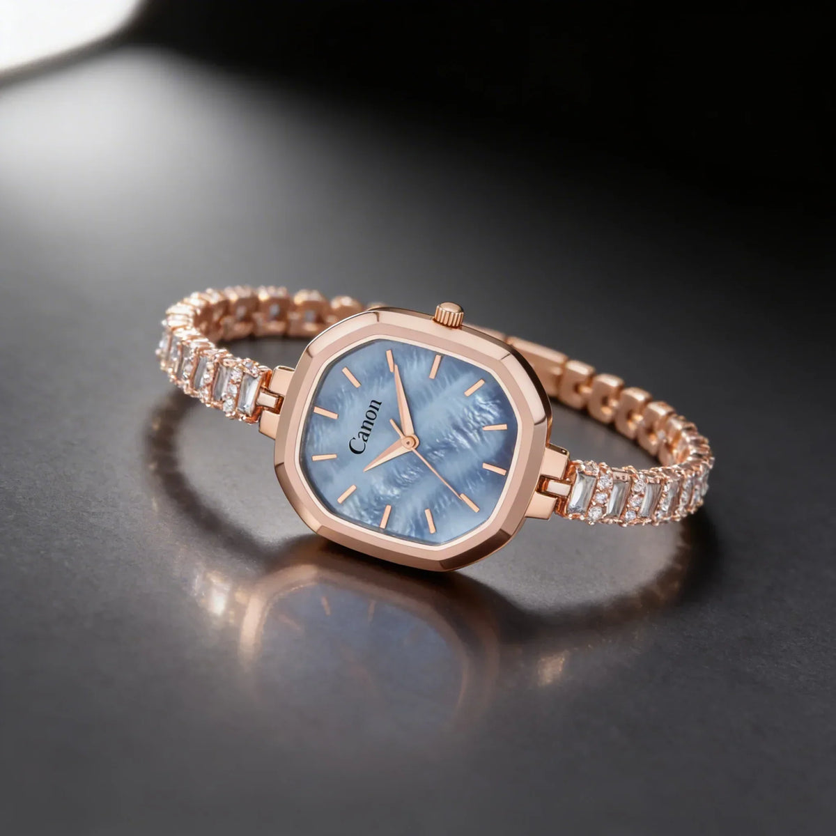 Elegant rose gold women's analog watch with blue mother-of-pearl dial and crystal bracelet