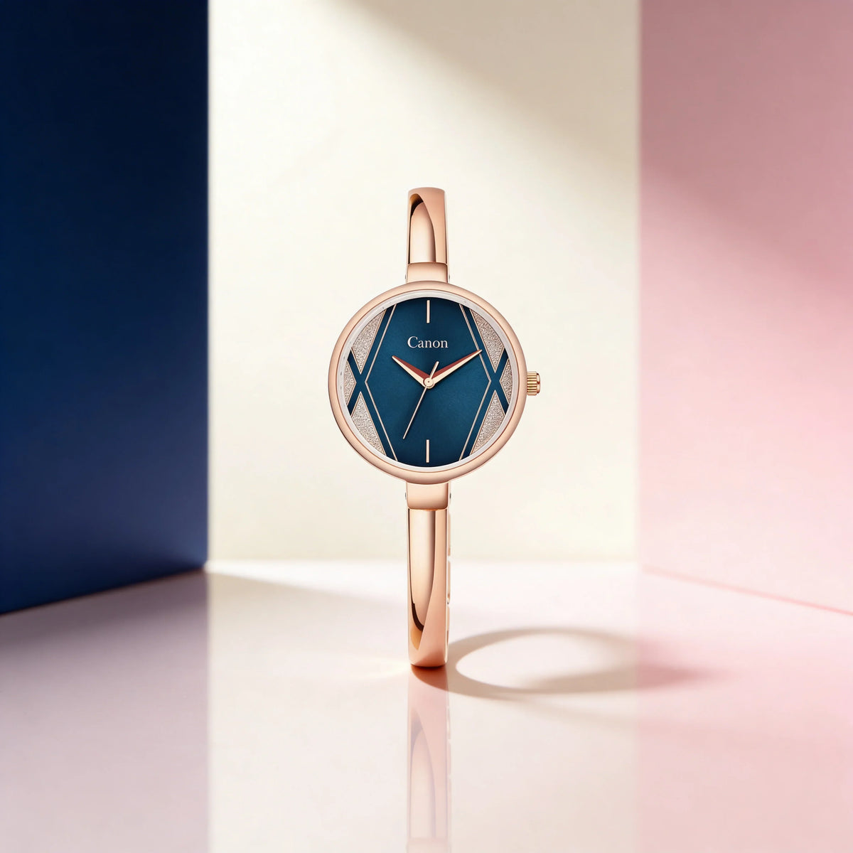 Elegant rose gold analog watch with blue dial on geometric pastel background