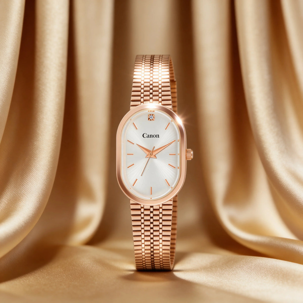 Elegant rose gold Canon watch with white dial and diamond accent, set against luxurious satin backdrop