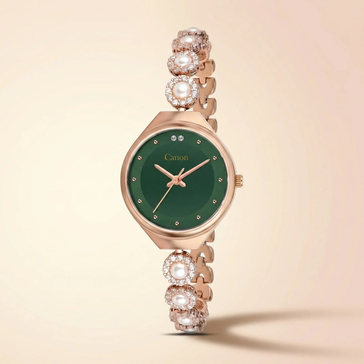 Elegant rose gold watch with green dial, pearl & crystal accents, analog quartz design for women