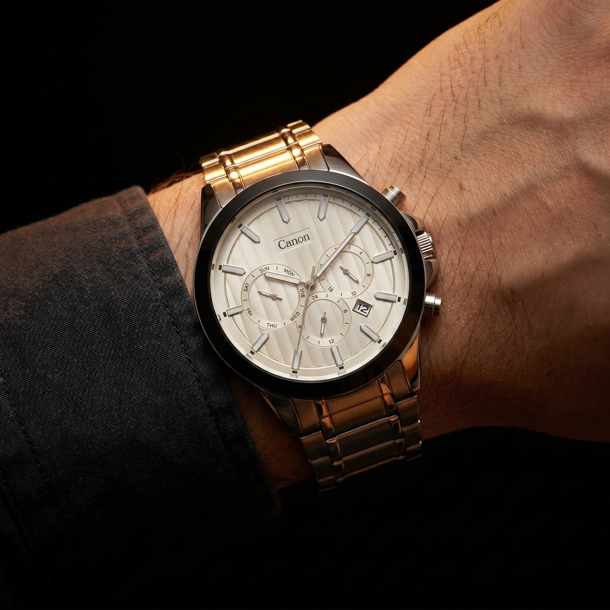 Canon men's analog quartz watch with day-date subdials, silver-tone bracelet, and white dial on wrist