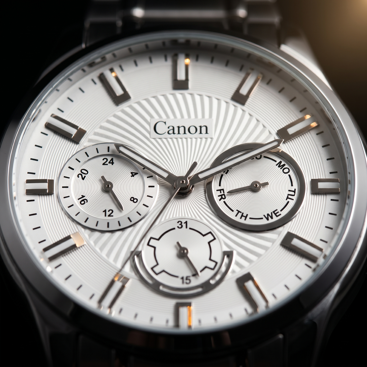 Canon analog quartz watch with day, date, and 24-hour subdials on sunburst dial
