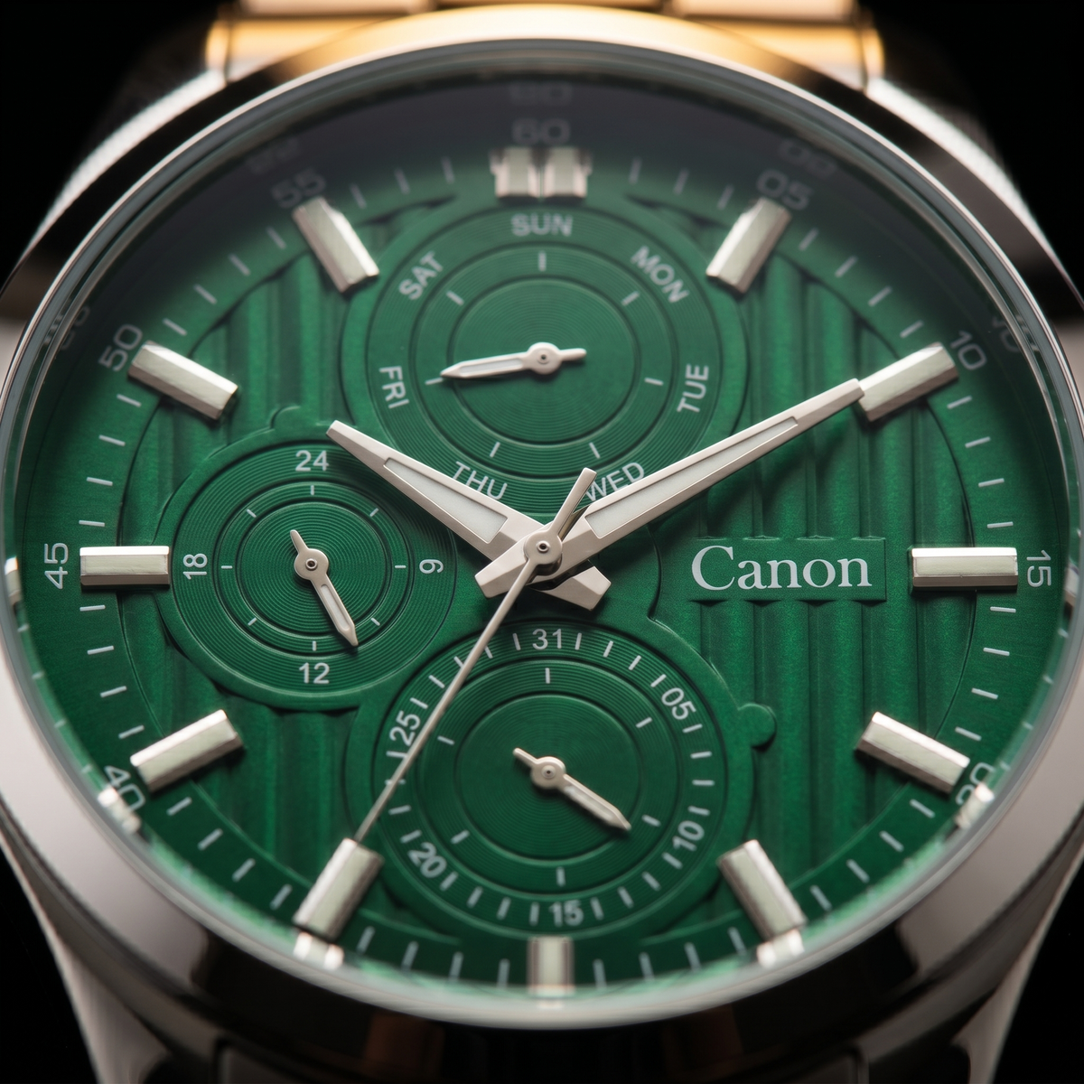 Green dial analog quartz watch with day-date subdials, silver hands, and Canon branding