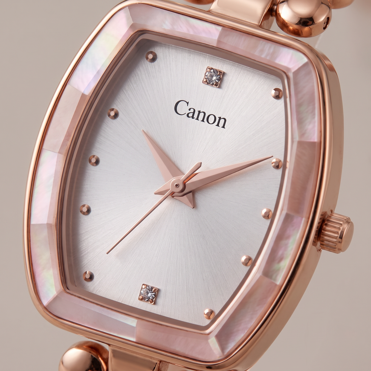 Macro close-up of CN-524 silver dial with crystal accents and faceted pearlescent bezel
