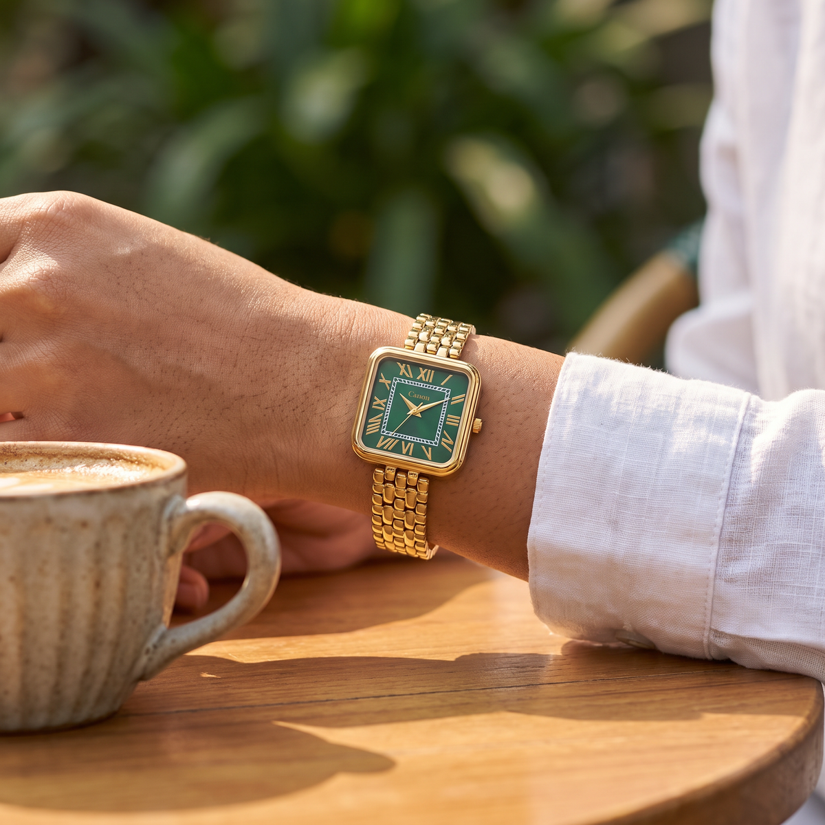 Woman wearing CN-532 at a sunlit cafe table beside a coffee cup