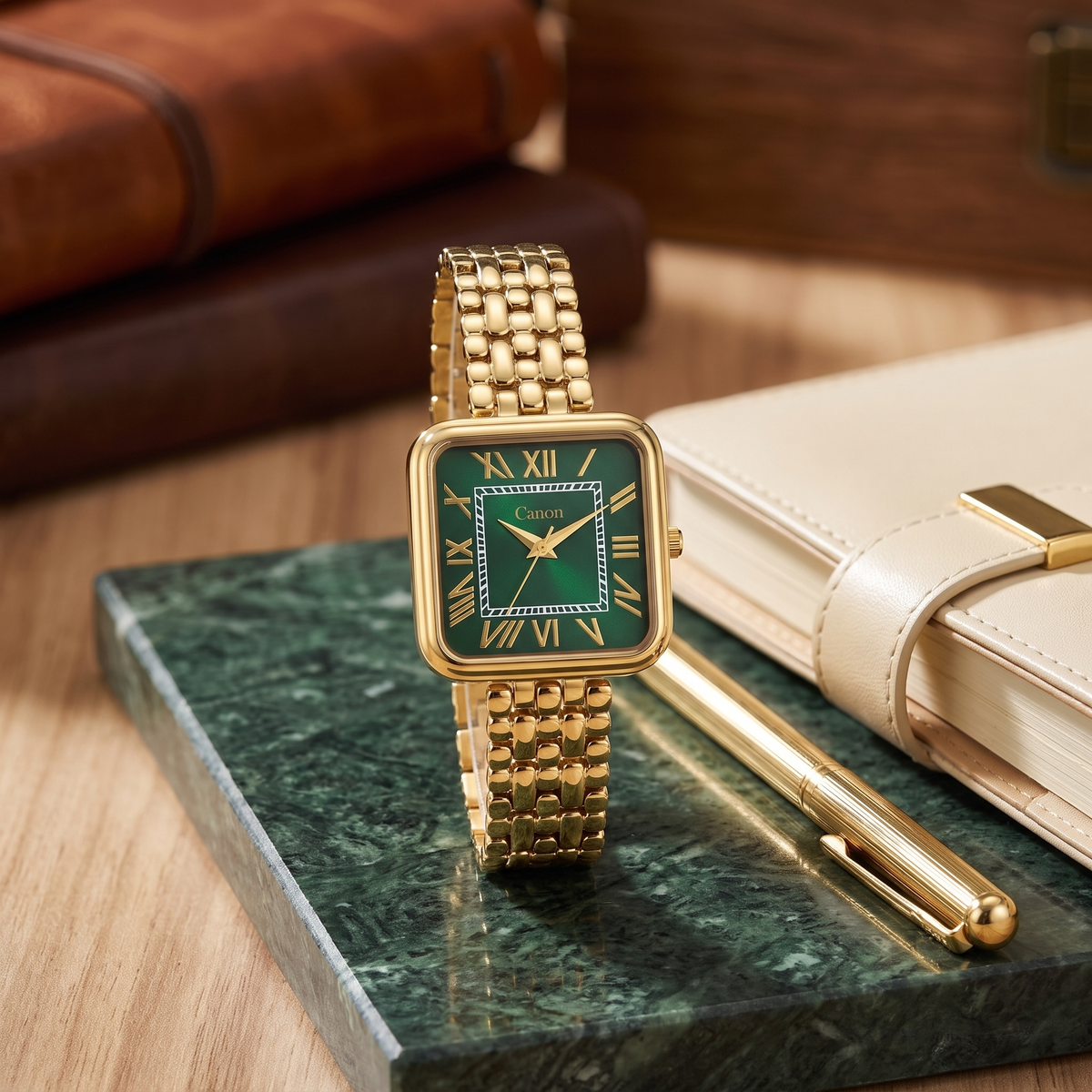 CN-532 Maha Vastu watch on green marble beside a gold pen and cream diary