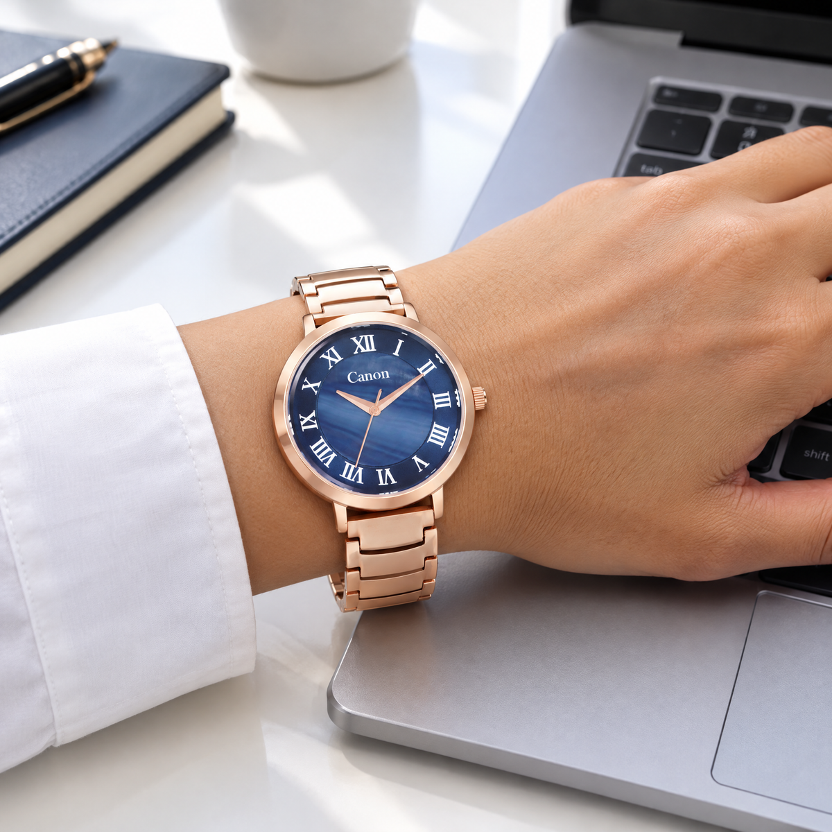 Woman wearing CN-540 while working on a laptop