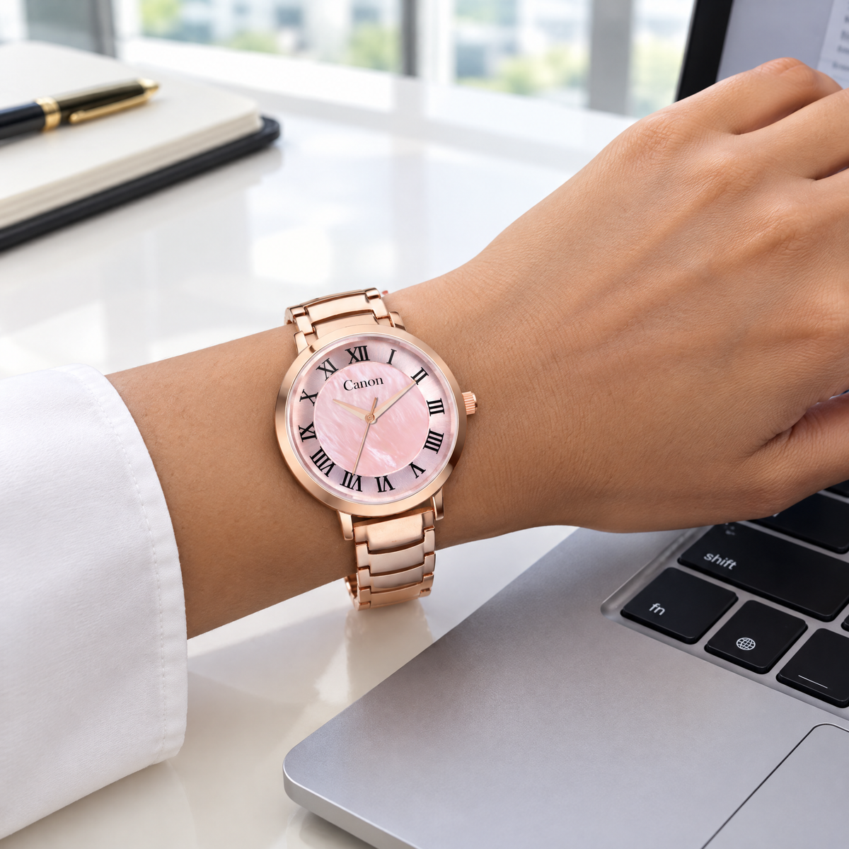 Woman wearing CN-542 while working on a laptop