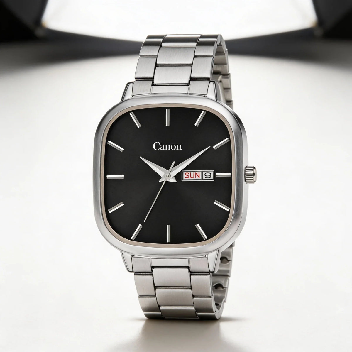 Men's analog wristwatch with black dial, stainless steel band, and day-date display