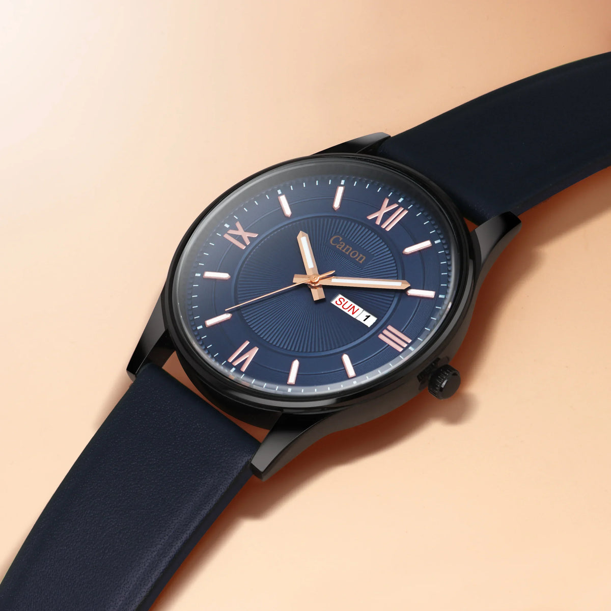 Analog wristwatch with blue strap, navy dial, rose gold Roman numerals, and day-date display