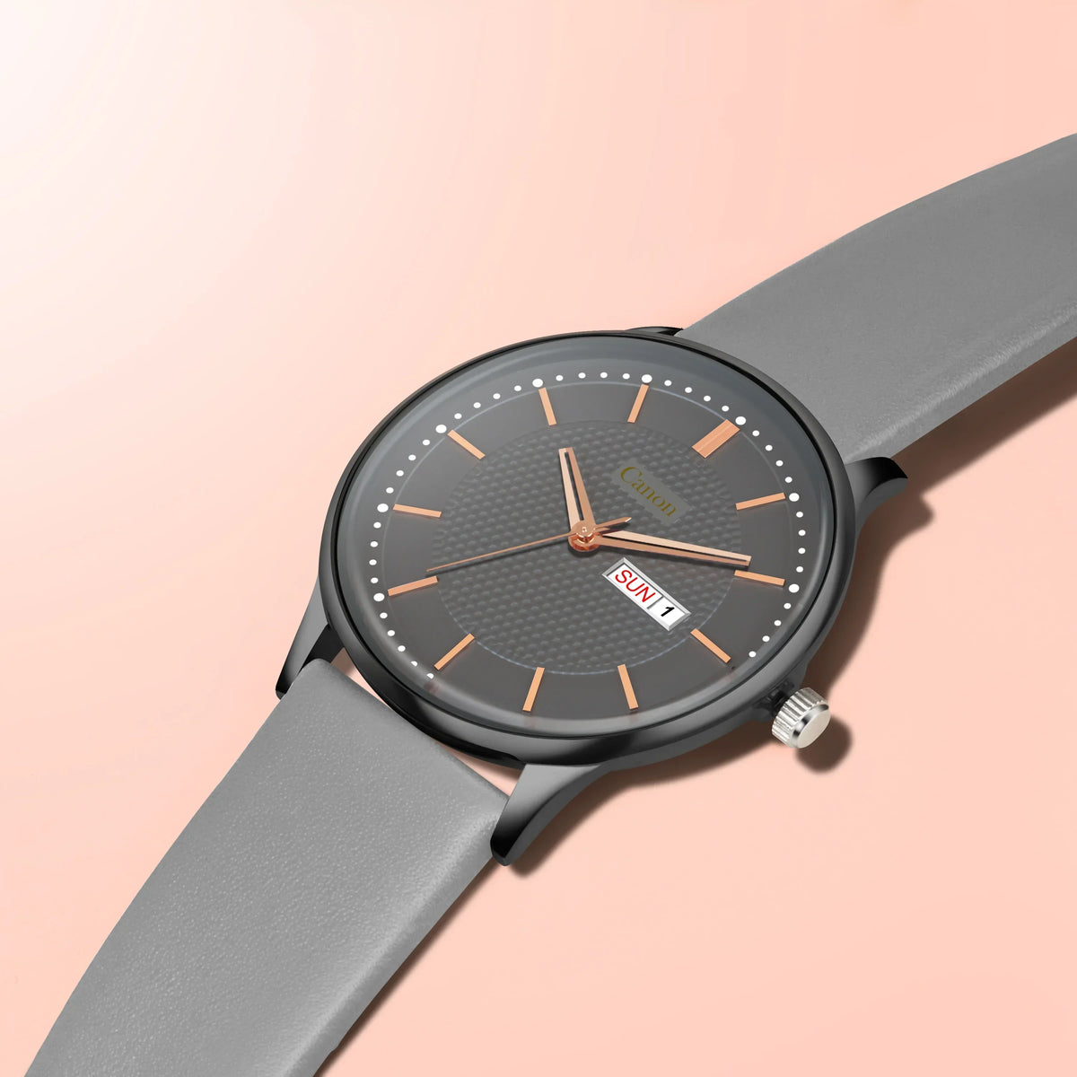 Gray analog wristwatch with black textured dial, rose gold markers, and day-date display