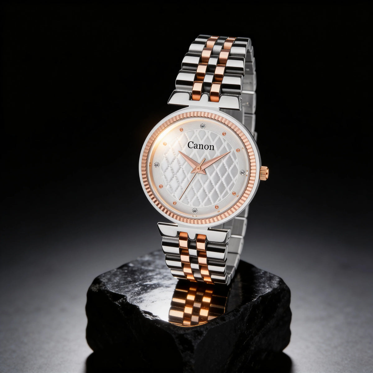 Elegant analog watch with rose gold accents, diamond markers, and quilted dial on black display stand