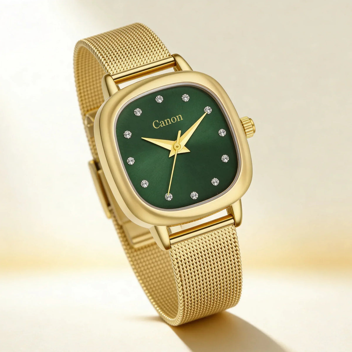 Elegant gold watch with green dial, crystal hour markers, and mesh strap — timeless analog design for women.