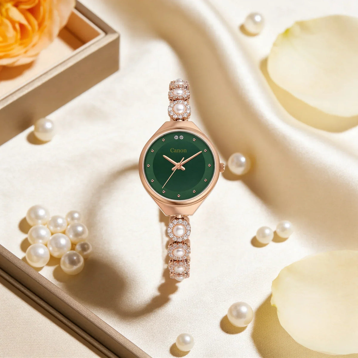 Elegant green dial watch with pearl and crystal accents, styled with pearls and soft fabric