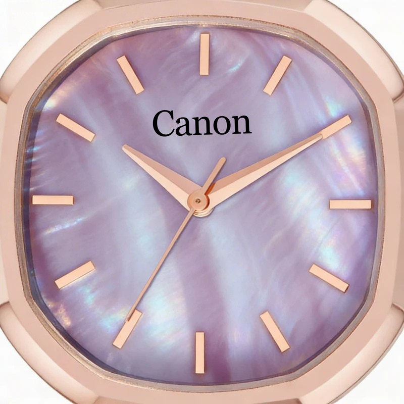 Rose gold watch with a purple face displaying the brand 'Canon'.