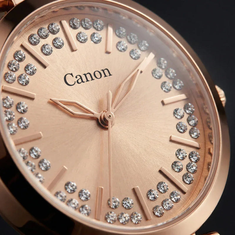 Ladies rose gold analog watch with crystal accents on dial, close-up detail