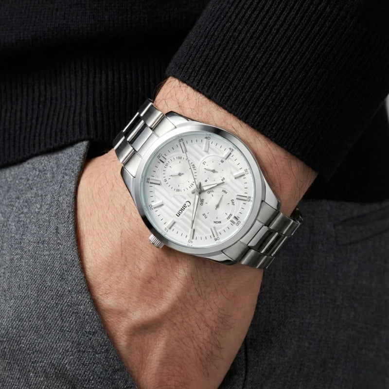 Canon Quartz silver analog men's watch with white dial on wrist, stylish business attire