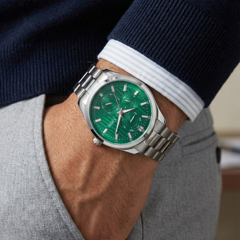 Canon Quartz men's analog watch with green dial and silver band on wrist