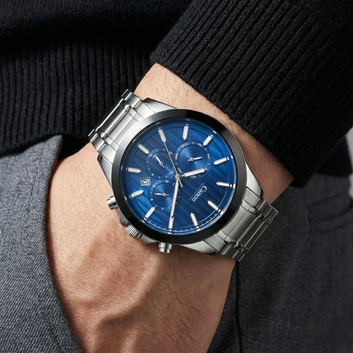 Men's analog quartz watch with blue dial, chronograph subdials, and stainless steel strap on wrist
