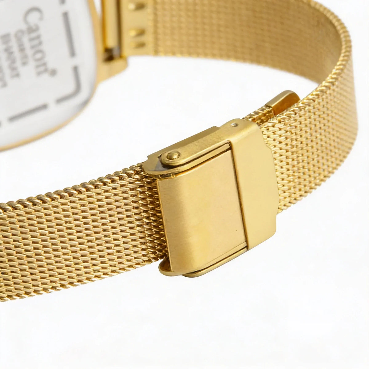 Close-up of gold mesh analog watch band with secure clasp on white background