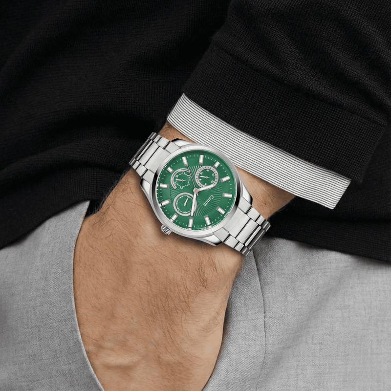 Canon Watches men's quartz analog watch with green dial and silver metal band on wrist