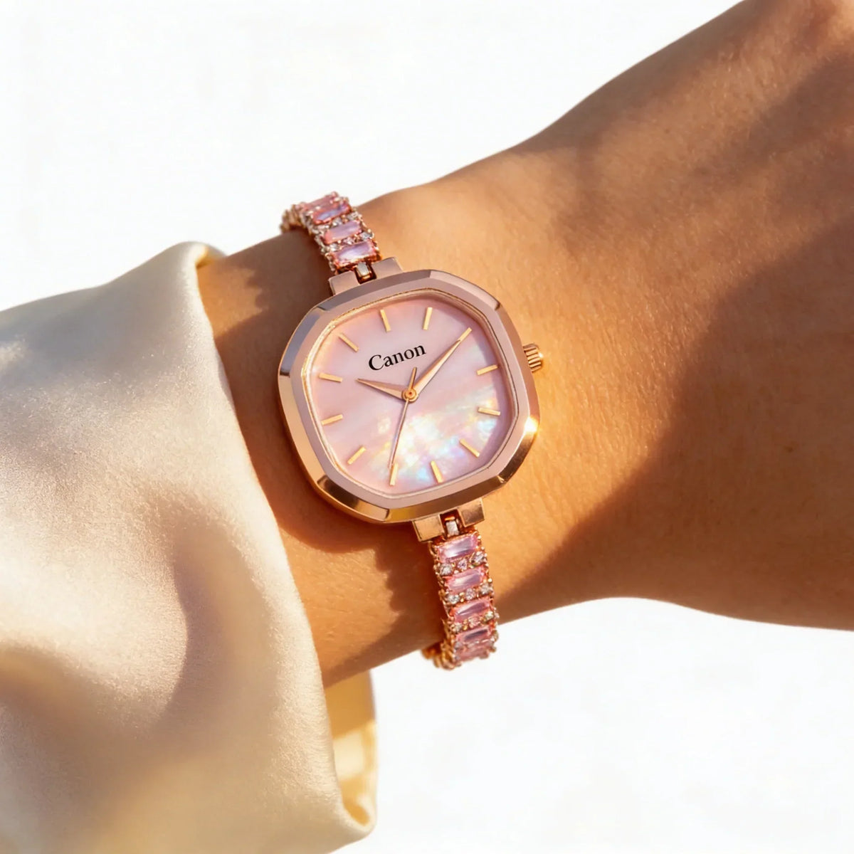 Rose gold analog watch with pink gemstone bracelet and mother-of-pearl dial on wrist