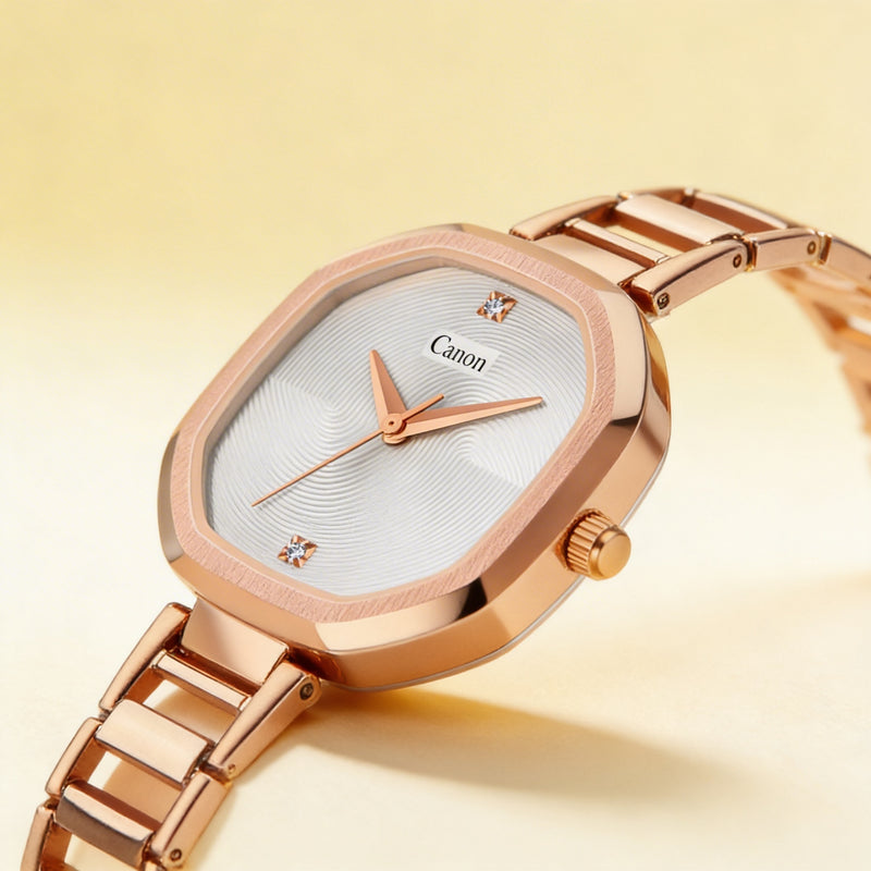 Rose gold analog wristwatch with geometric face and minimalist design on a light background