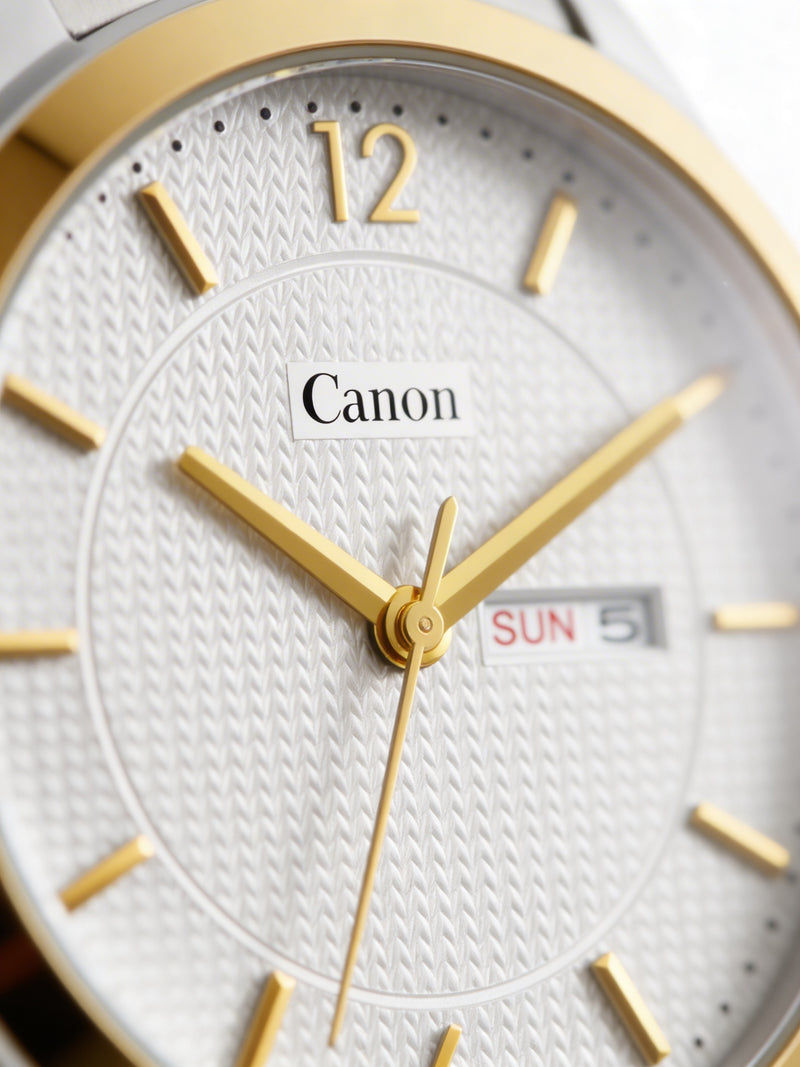 Elegant analog watch with gold markers, white textured dial, and day-date display