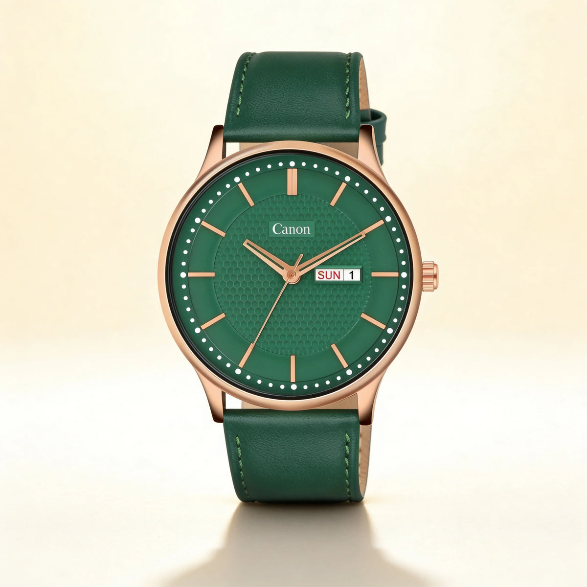 Green analog wristwatch with gold case, date display, and leather strap on beige background