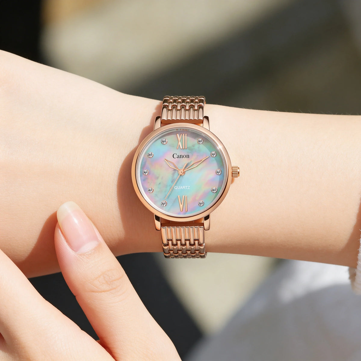 Elegant women's rose gold analog watch with iridescent dial and crystal hour markers.