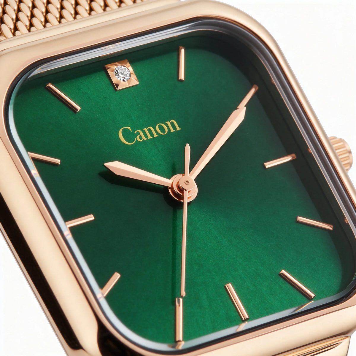 Gold analog watch with green face, diamond detail, and mesh strap, stylish and elegant