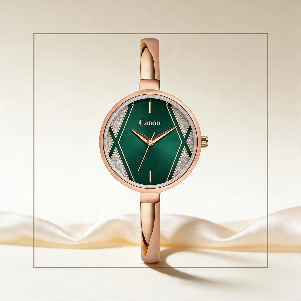 Elegant rose gold watch with green dial and geometric design, featuring Canon branding on face.