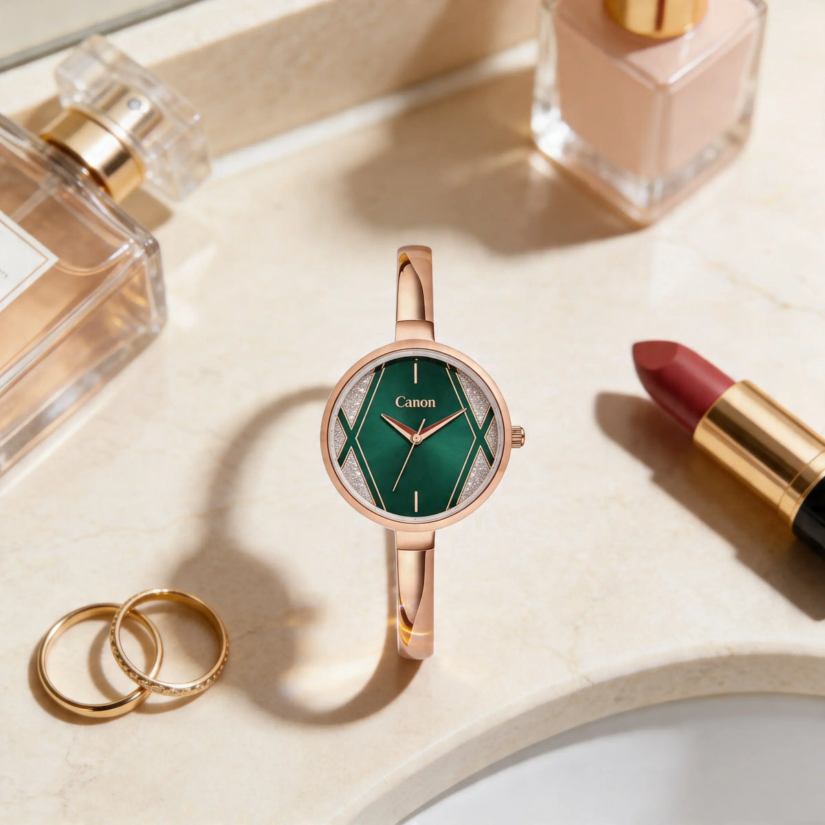 Elegant green dial analog watch with rose gold bracelet, styled with perfume, lipstick, and rings for women's fashion.