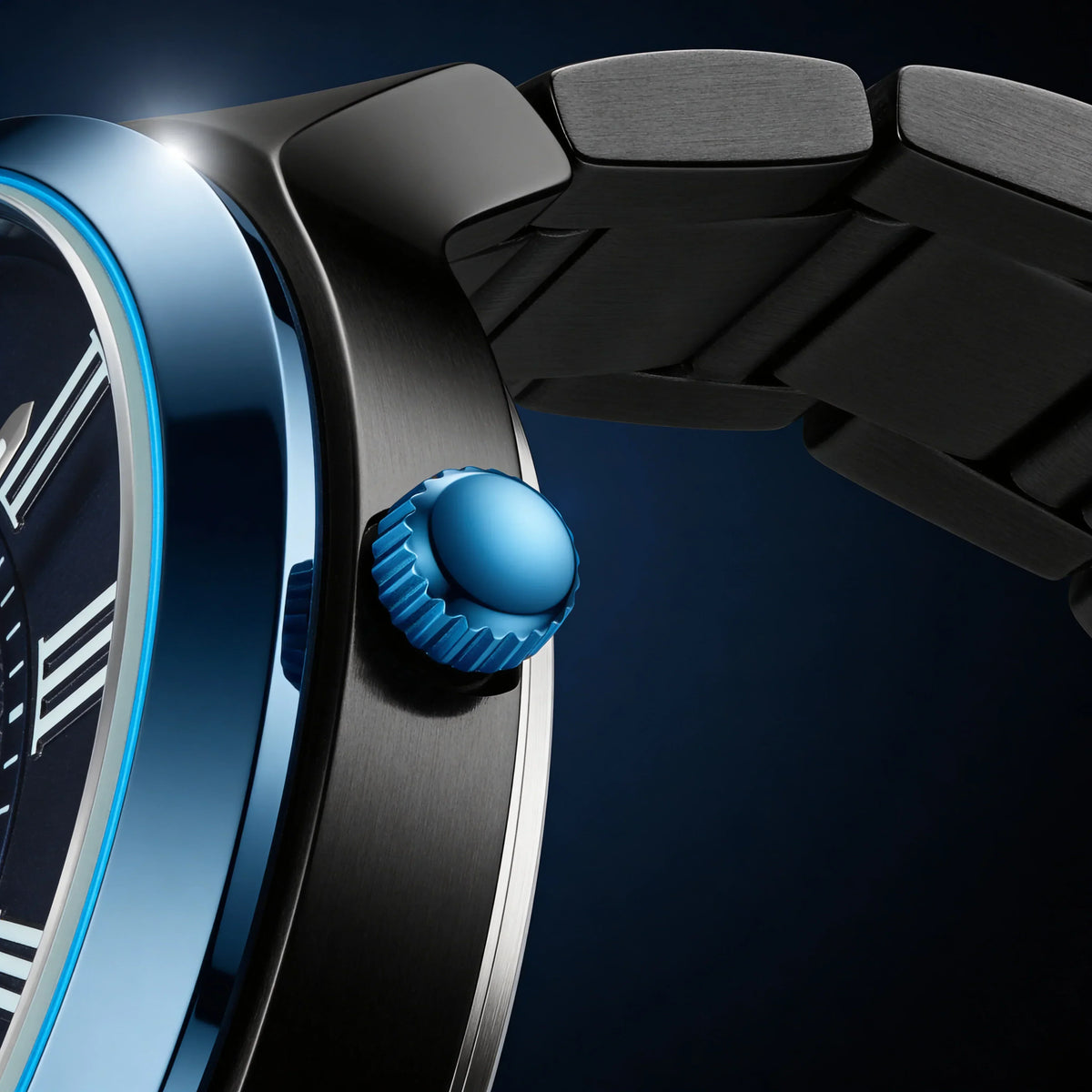 Luxury analog watch with blue crown, brushed metal case, and dark dial detail