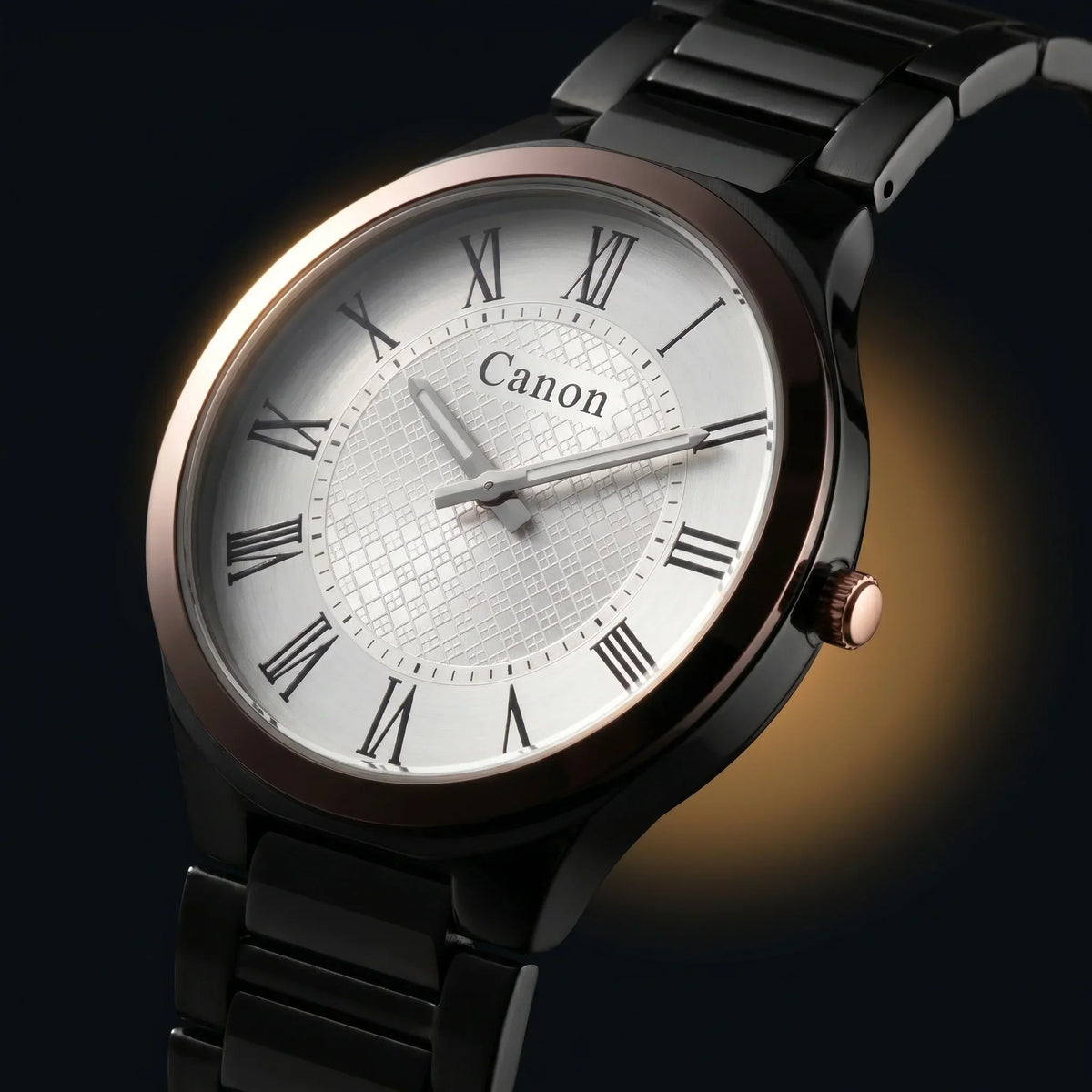 Canon analog watch with Roman numerals, black metal band, and rose gold accents on dark background