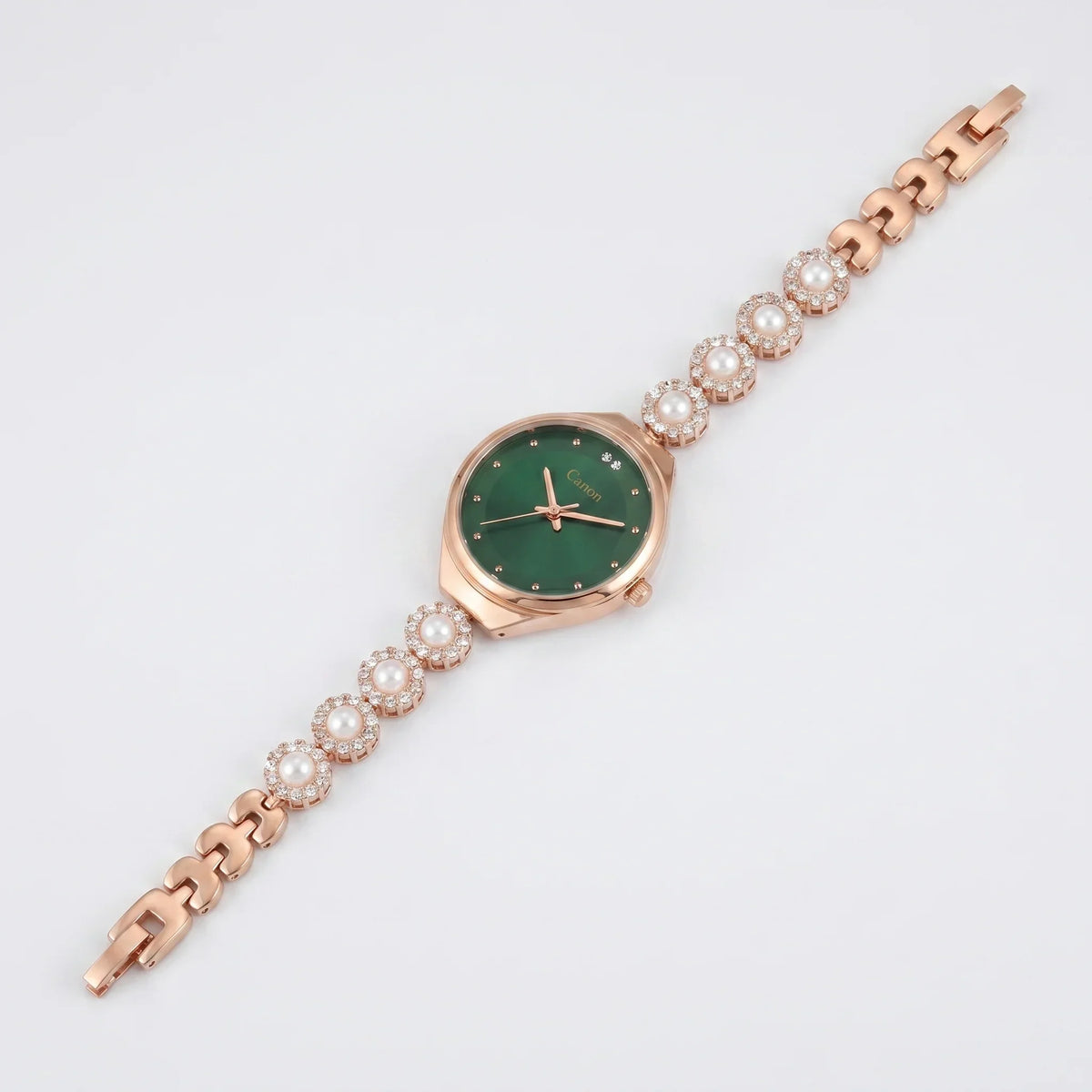 Elegant rose gold watch with green dial, pearl & crystal accents on bracelet, analog quartz design