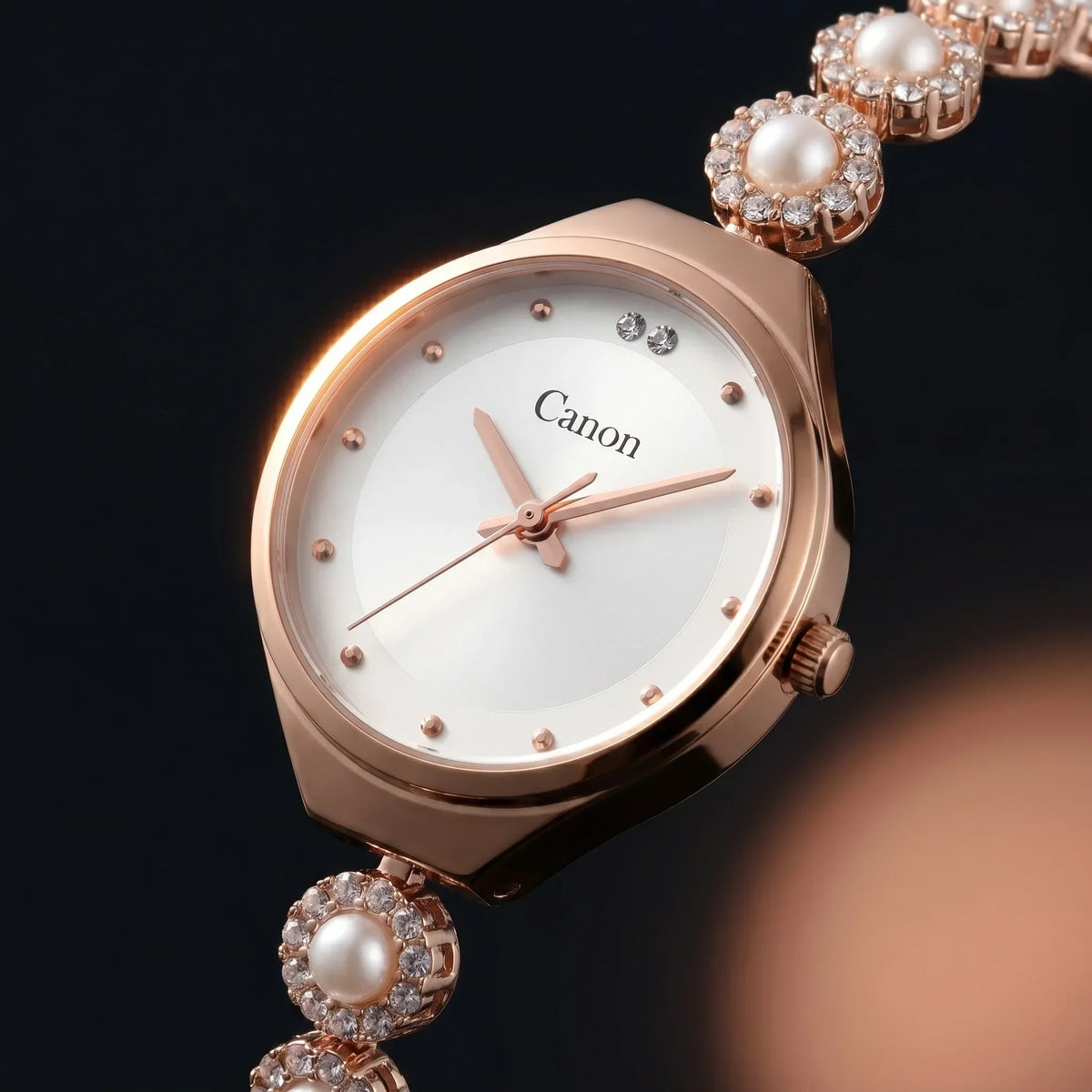 Elegant rose gold analog watch with pearl and crystal bracelet, white dial, Canon logo