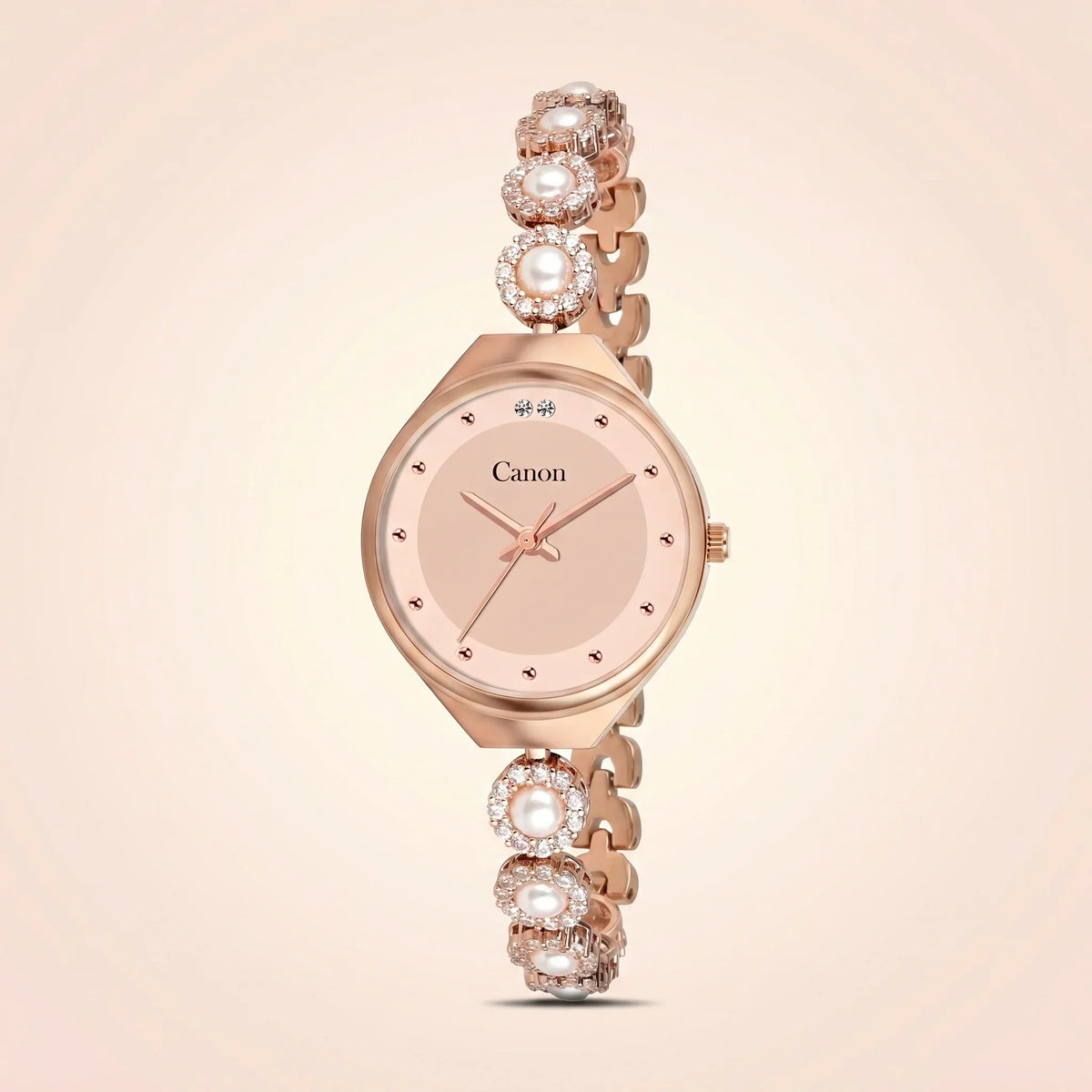 Elegant rose gold analog watch with pearl and crystal accents, featuring a classic dial and decorative bracelet.