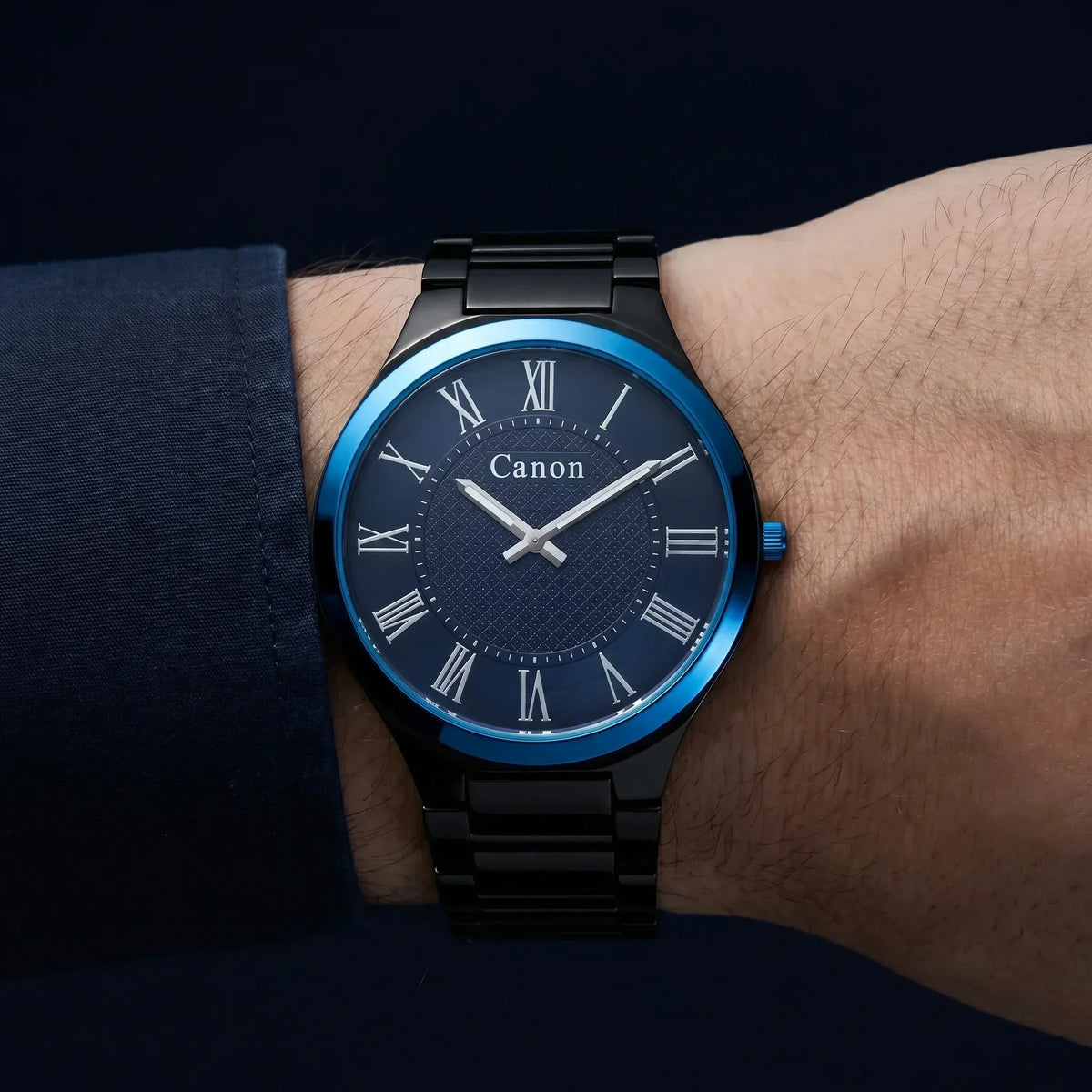Canon men's analog watch with blue dial, Roman numerals, and black metal band on wrist