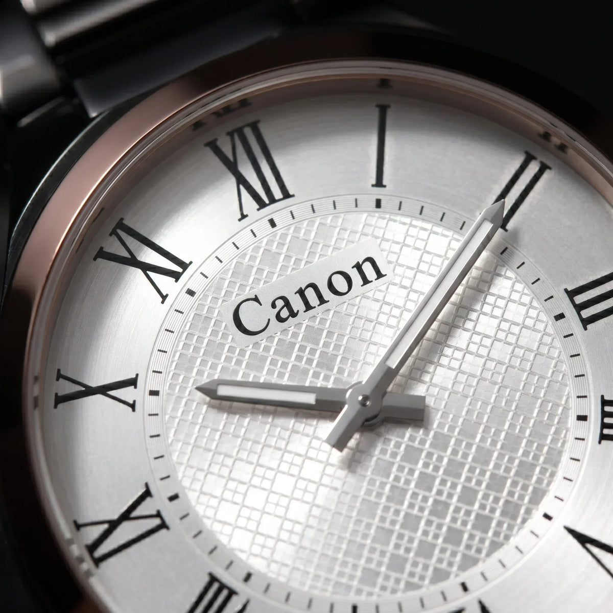Elegant Canon analog watch with Roman numerals and textured dial design