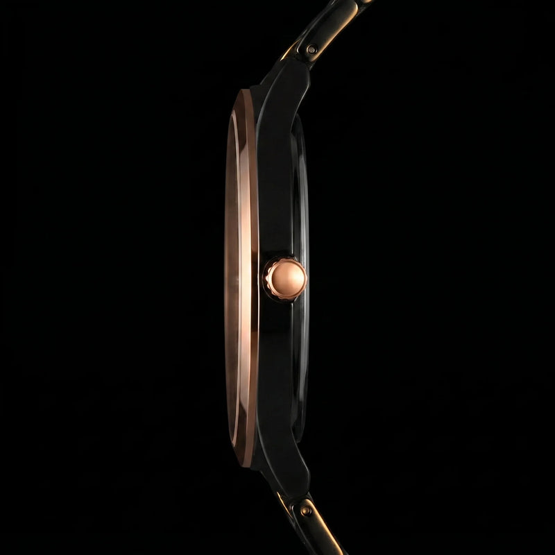 Slim black and rose gold analog watch side view, showcasing sleek design and crown detail