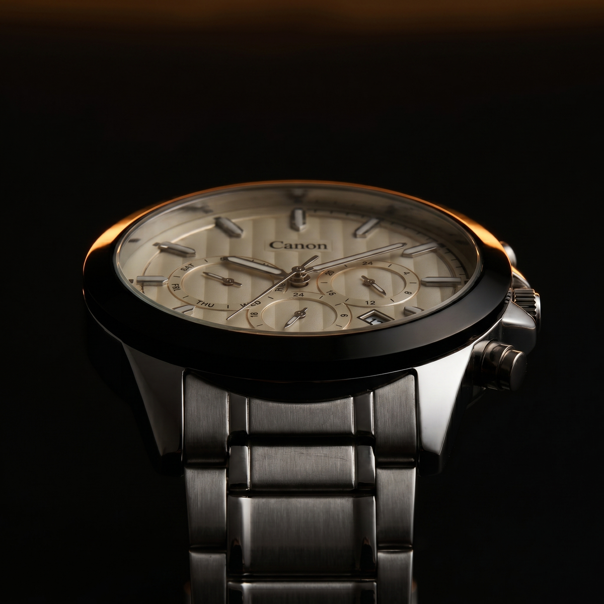 Canon men's analog quartz watch with day-date subdials, stainless steel strap, and elegant dial design