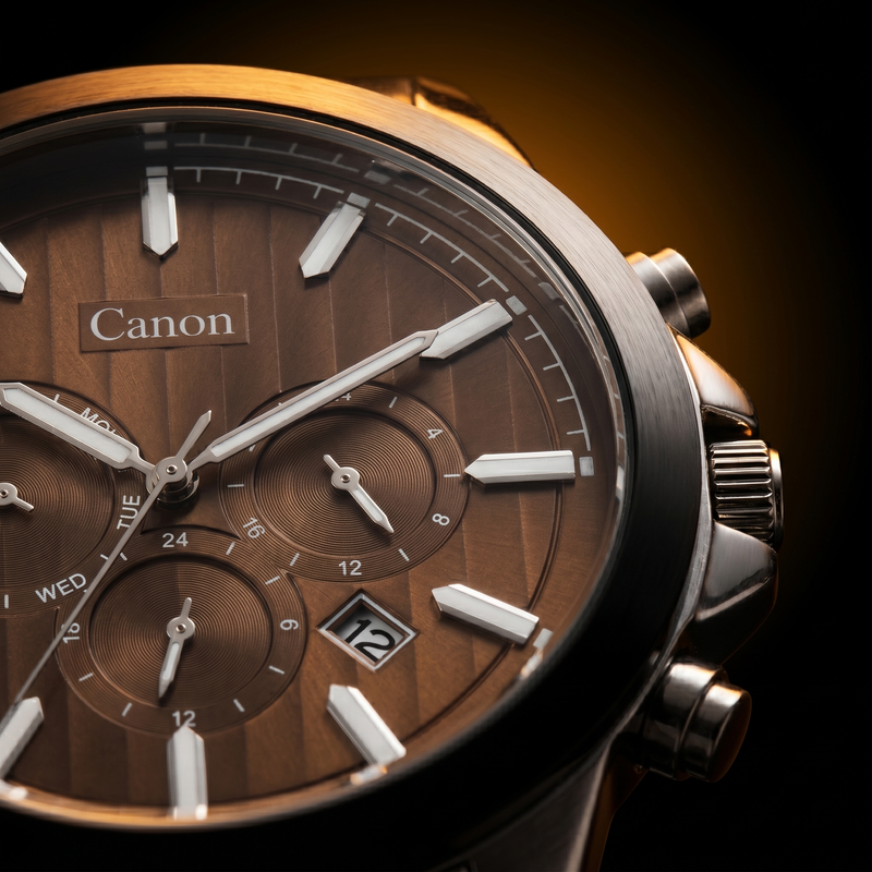 Canon men's analog quartz watch with brown dial, day-date subdials, and Japanese Miyota movement
