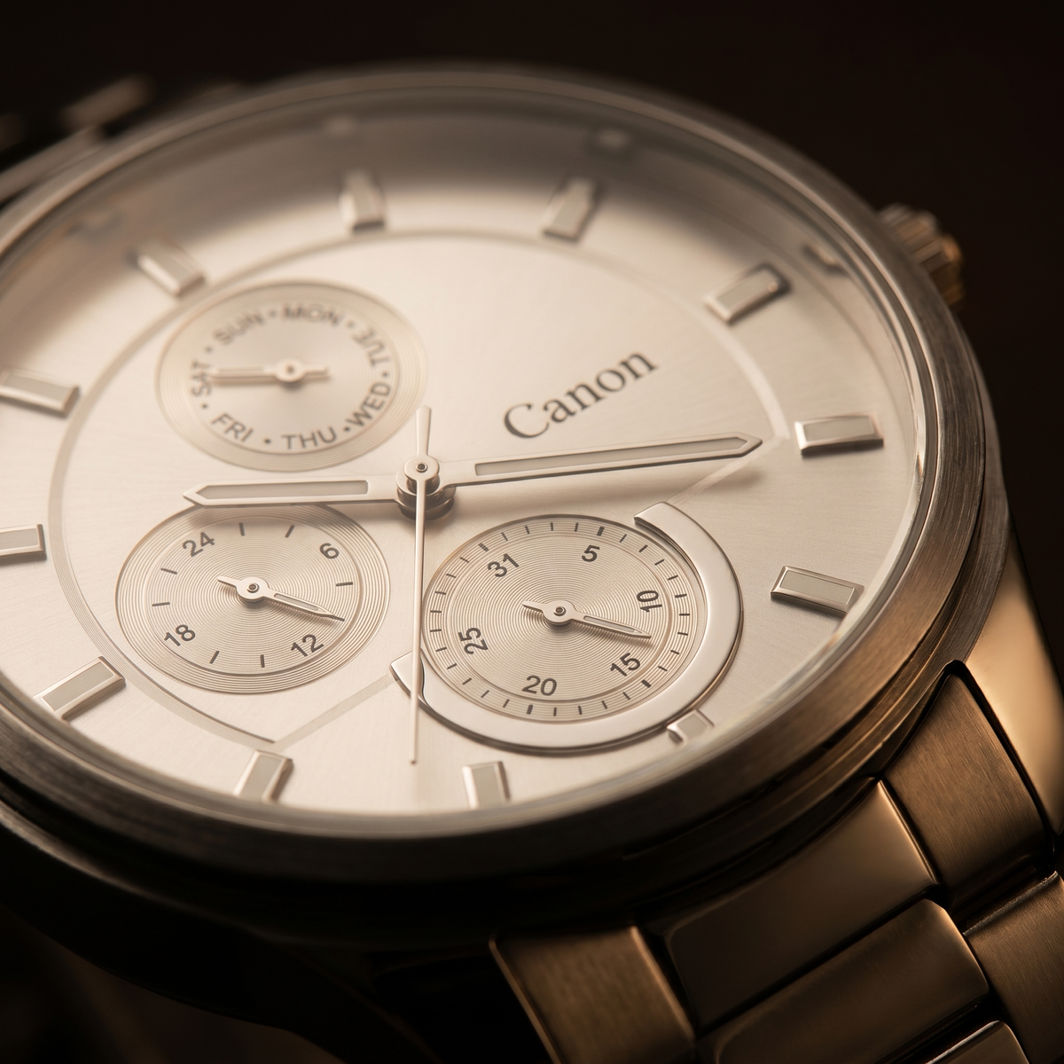 Canon analog quartz watch with day, date & 24-hour subdials, silver dial, metal bracelet