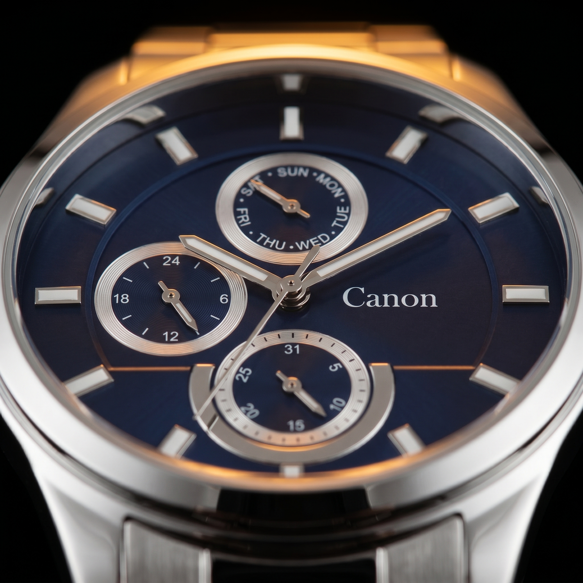 Canon men's analog quartz watch with blue dial, day-date subdials, and stainless steel strap