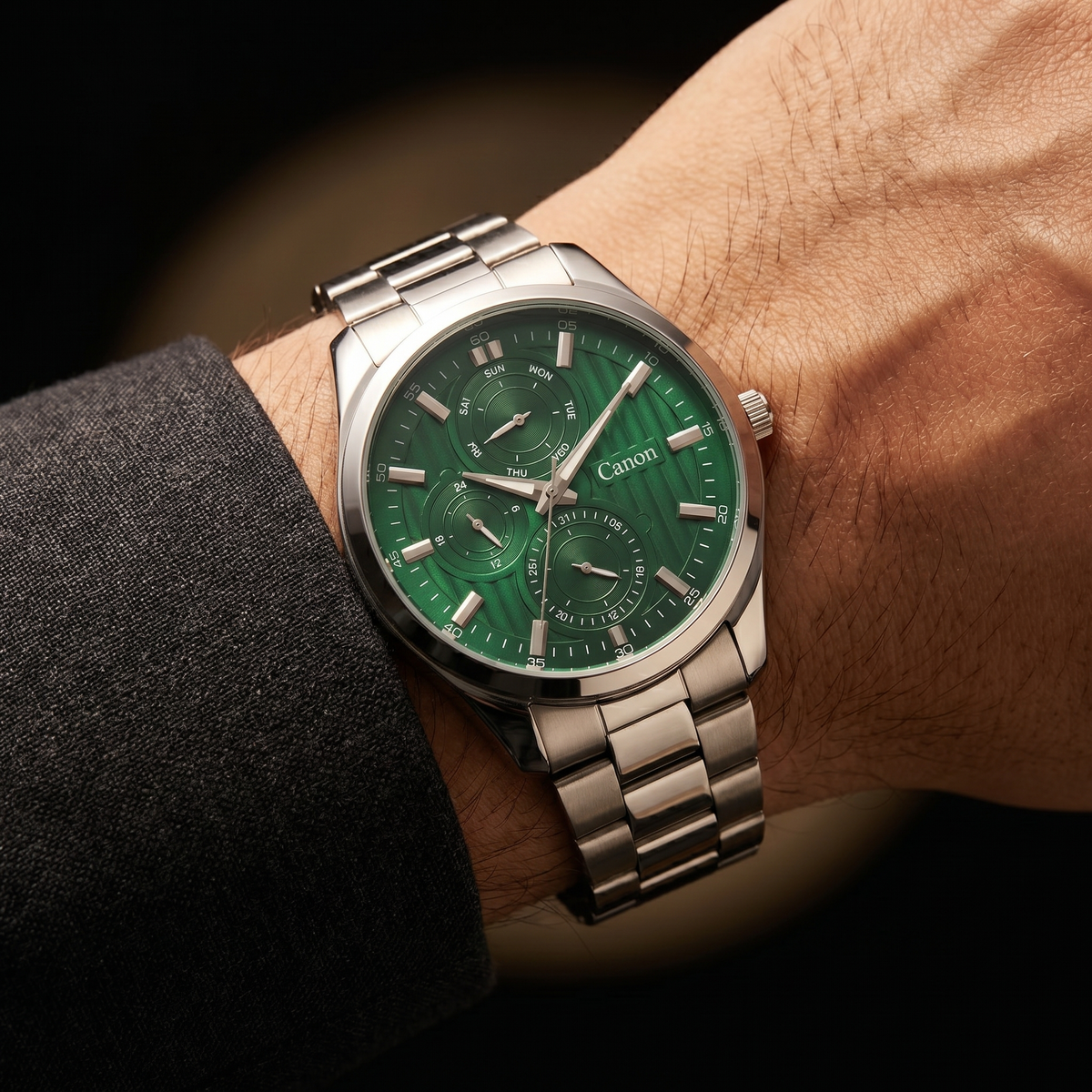 Green dial analog quartz watch with day-date subdials on wrist, silver stainless steel band