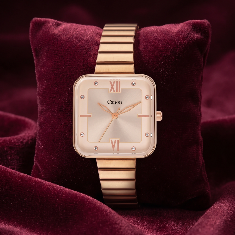 Elegant rose gold square analog watch with Roman numerals and crystal accents, displayed on velvet