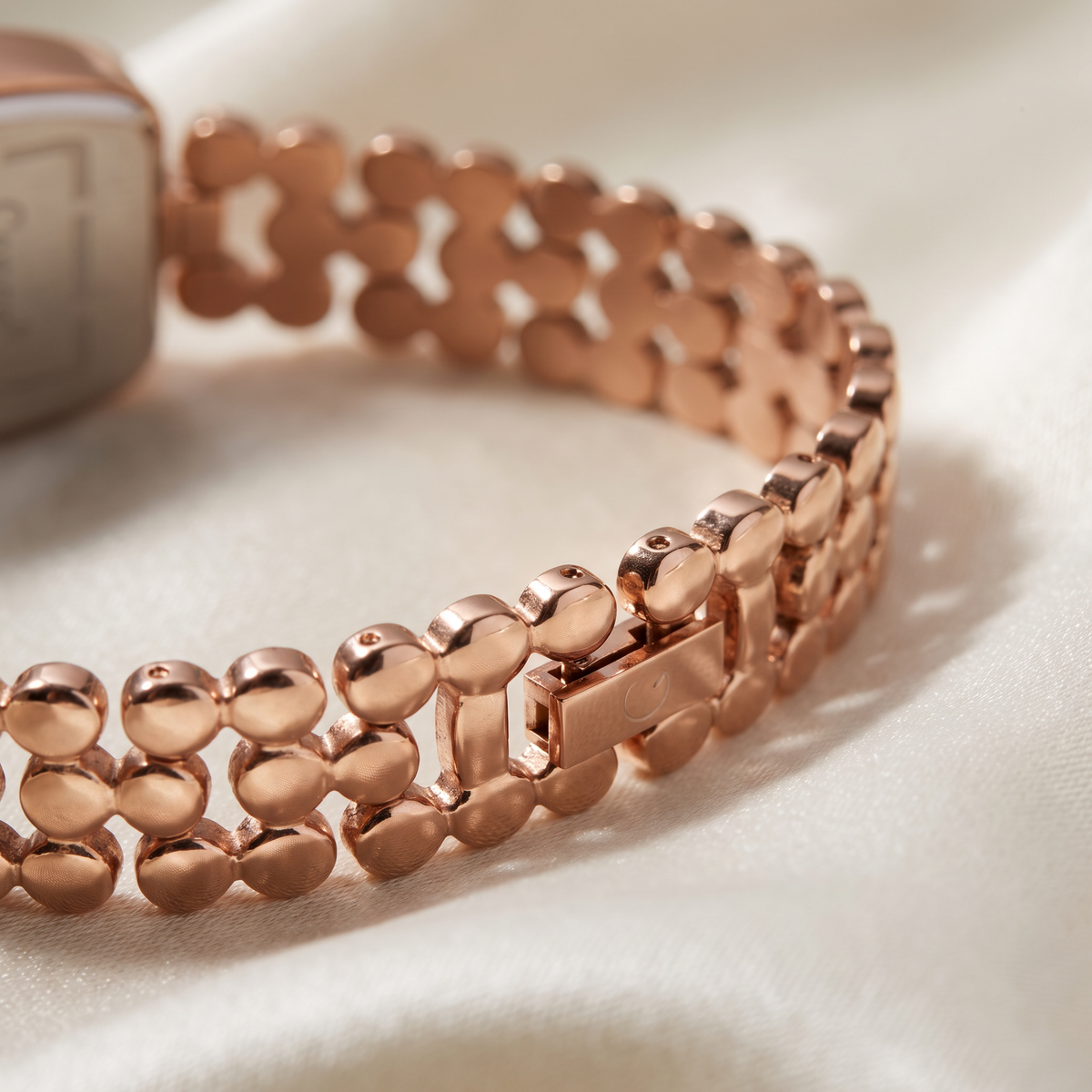 Macro of CN-524 rose gold pebble-link stainless steel bracelet and fold-over clasp
